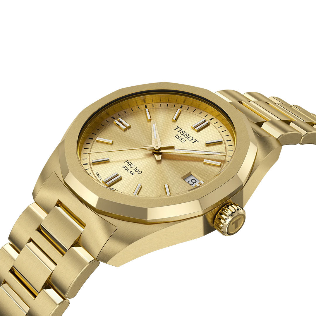 The Tissot PRC 100 Solar Quartz 34mm Watch features a gold-tone metal link bracelet, gold dial with hour markers, date window at 3 o’clock, and a textured bezel—reflecting Tissot's light-powered precision.