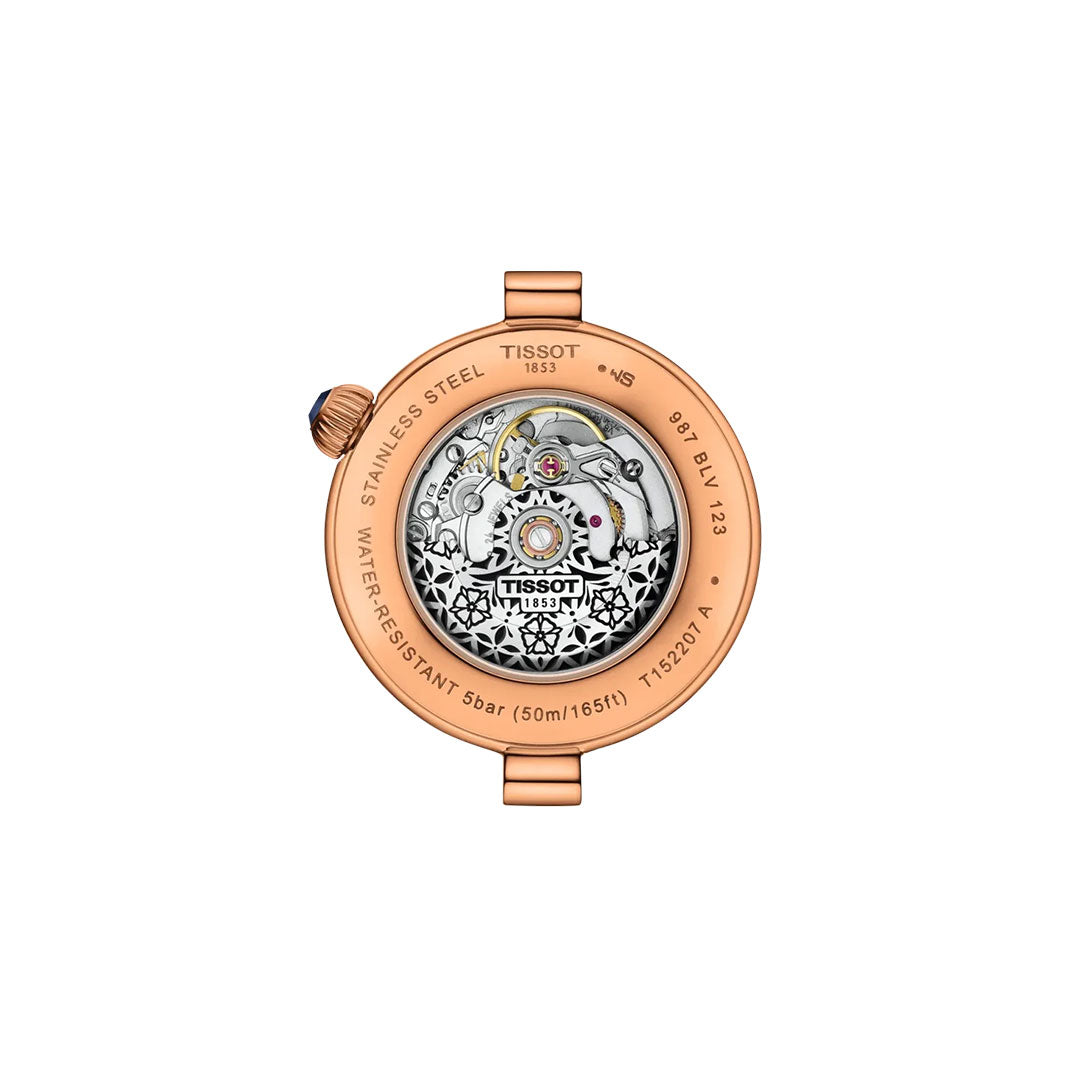 The back view of the Tissot Desir Automatic 28mm Watch in rose gold PVD displays its stainless steel build and detailed automatic movement through a transparent cover, with engraved details visible around the edge.