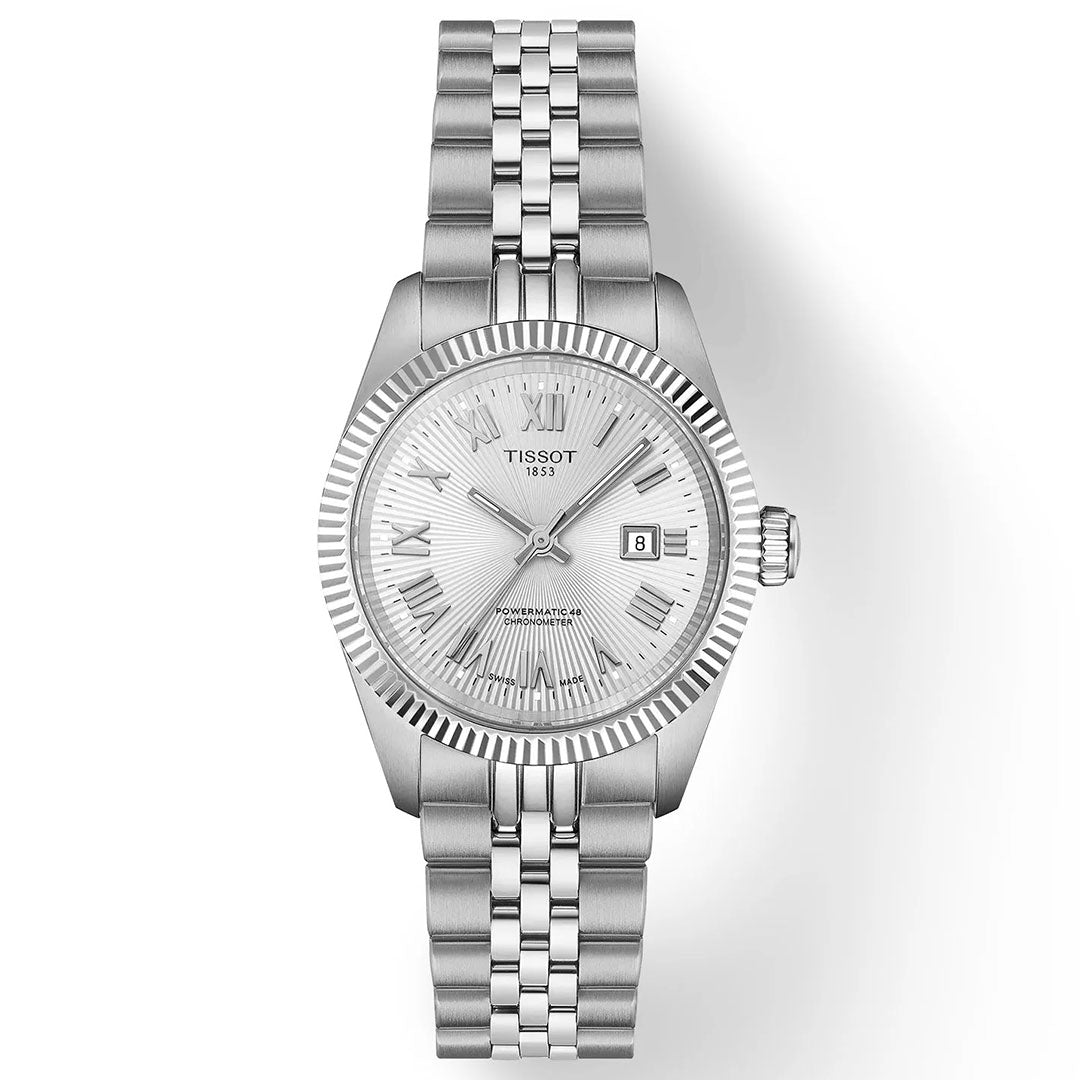 The Tissot Ballade Powermatic 80 Automatic 30mm Watch features a metal link band, textured silver dial with Roman numeral hour markers, date at 3 o'clock, fluted bezel, and Powermatic 80 movement.