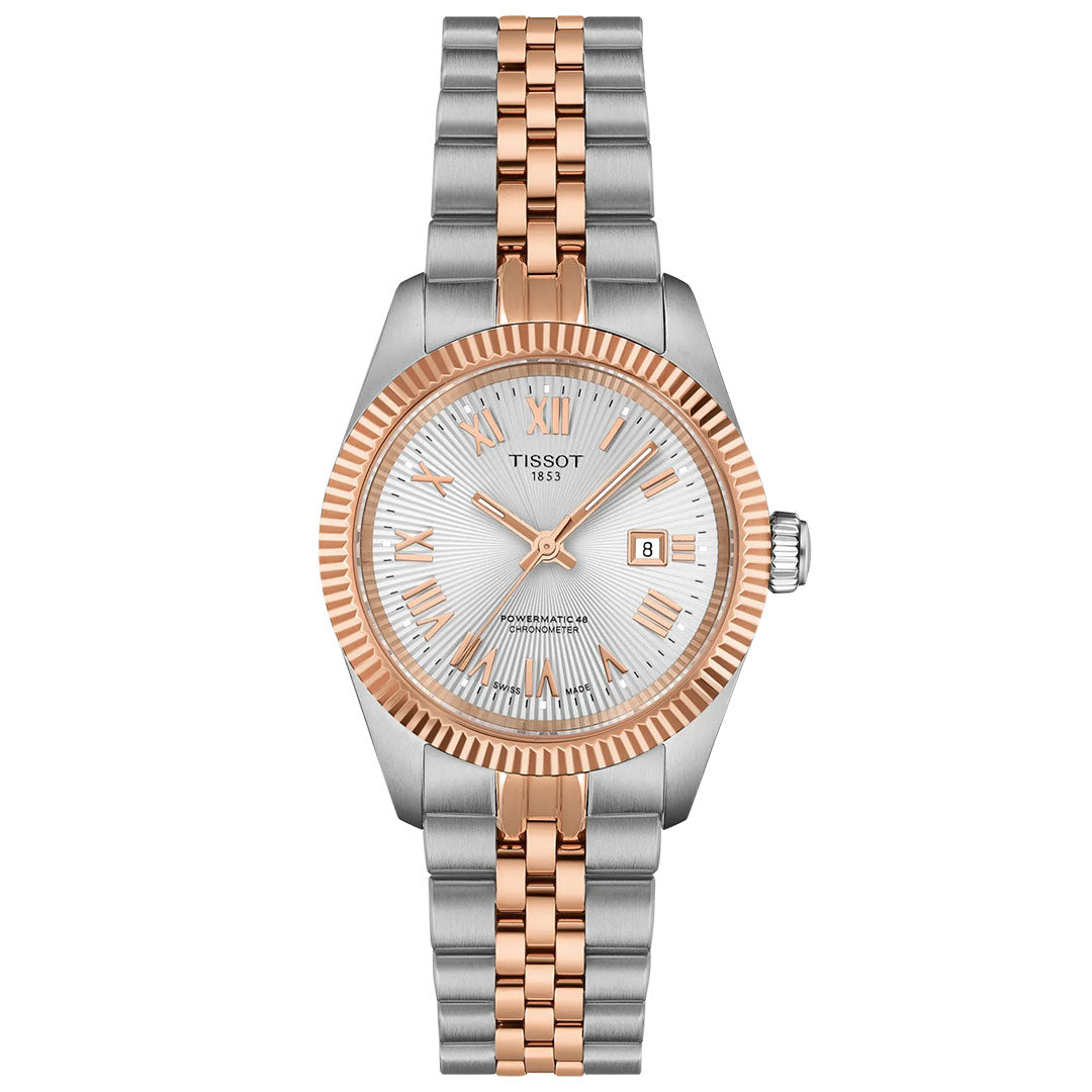 The Tissot Ballade Powermatic 80 Automatic 30mm Watch features a silver and rose gold metal band, fluted rose gold bezel, silver dial with Roman numerals, date window, three hands, and a COSC-certified Powermatic 80 movement.