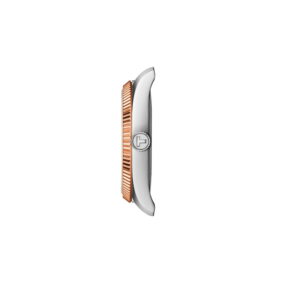 Side view of the Tissot Ballade Quartz 34mm Watch by Tissot, featuring a silver case, rose gold fluted bezel, round logo-engraved crown, and interchangeable bracelet, displayed against a plain white background.