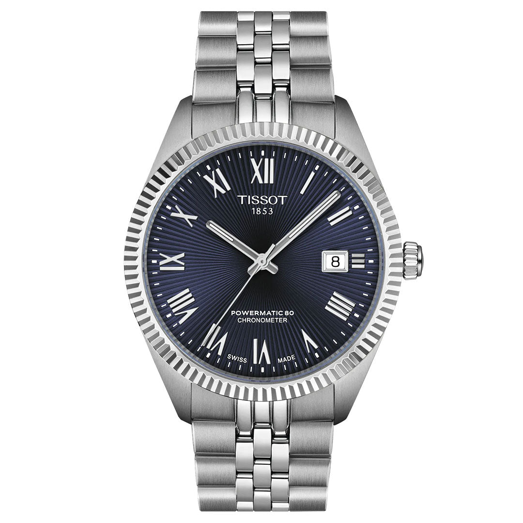 The Tissot Ballade Powermatic 80 Automatic 39mm Watch features a blue dial with Roman numerals, date at 3 o'clock, "POWERMATIC 80 CHRONOMETER" text, chronometer-certified movement, fluted bezel, and silver bracelet.
