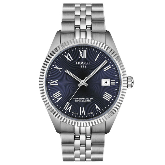 The Tissot Ballade Powermatic 80 Automatic 39mm Watch features a blue dial with Roman numerals, date at 3 o'clock, "POWERMATIC 80 CHRONOMETER" text, chronometer-certified movement, fluted bezel, and silver bracelet.