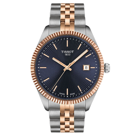 The Tissot Ballade Quartz 40mm Watch by Tissot features a navy blue guilloché dial, rose gold-tone hands and markers, Swiss Quartz movement, date window at 3 o’clock, and a two-tone silver and rose gold PVD bracelet.