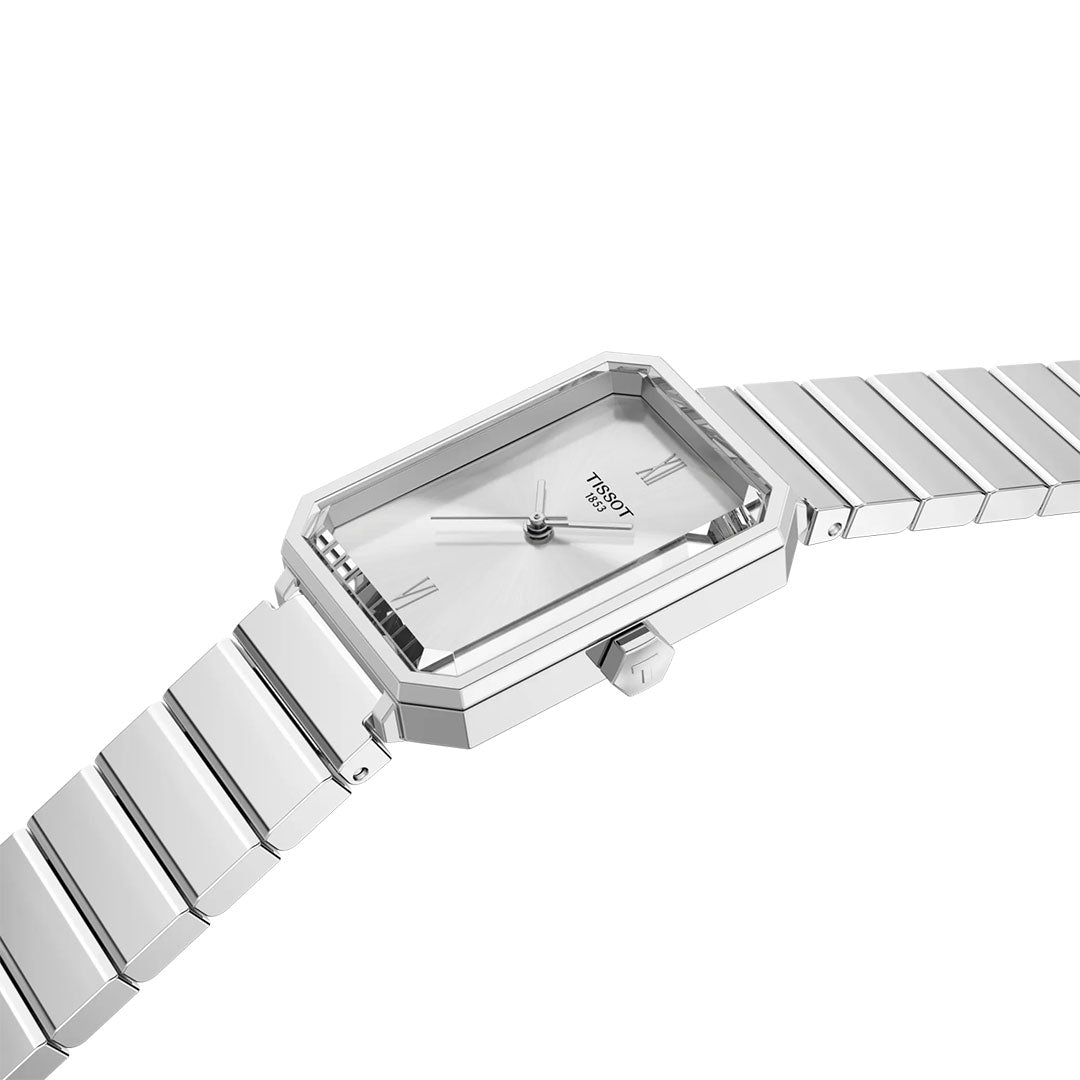 A Tissot SRV Quartz 30mm watch with a rectangular silver face, minimalist dial, and metal link bracelet is displayed at an angle on a white background.