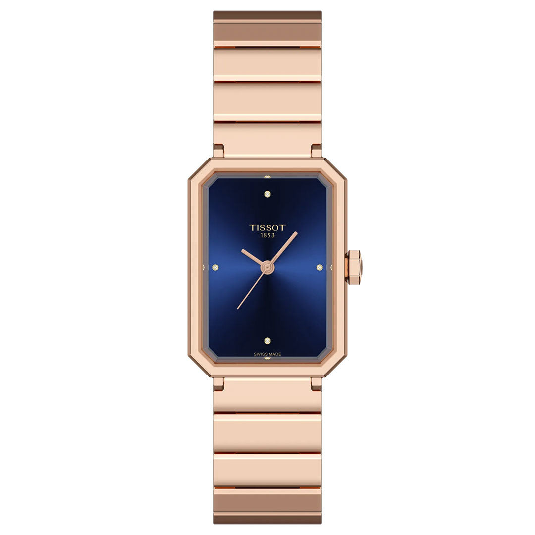 The Tissot SRV Quartz 30mm Watch features a rose gold rectangular case, blue dial with minimal gold markers, matching rose gold strap, and the “Tissot 1853” logo—a timeless Art Deco design by Tissot.