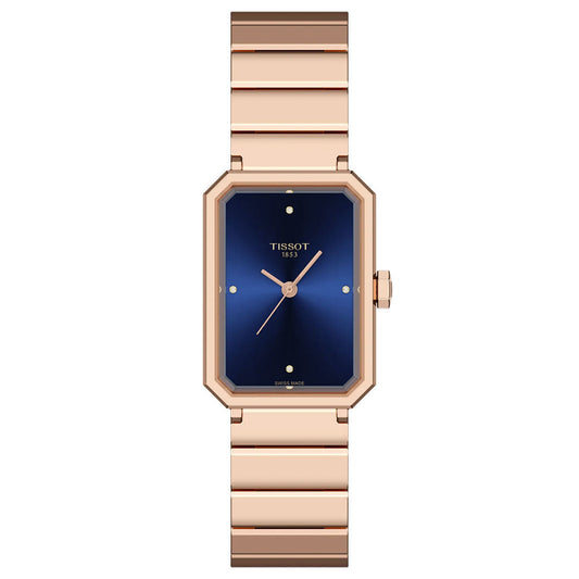 The Tissot SRV Quartz 30mm Watch features a rose gold rectangular case, blue dial with minimal gold markers, matching rose gold strap, and the “Tissot 1853” logo—a timeless Art Deco design by Tissot.