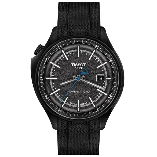 The Tissot Pinarello Mechanical Automatic COSC 43mm Watch features a textured black dial, silver hour markers, blue second hand, date display at 3 o’clock, and a sleek black forged carbon case with a textured strap.