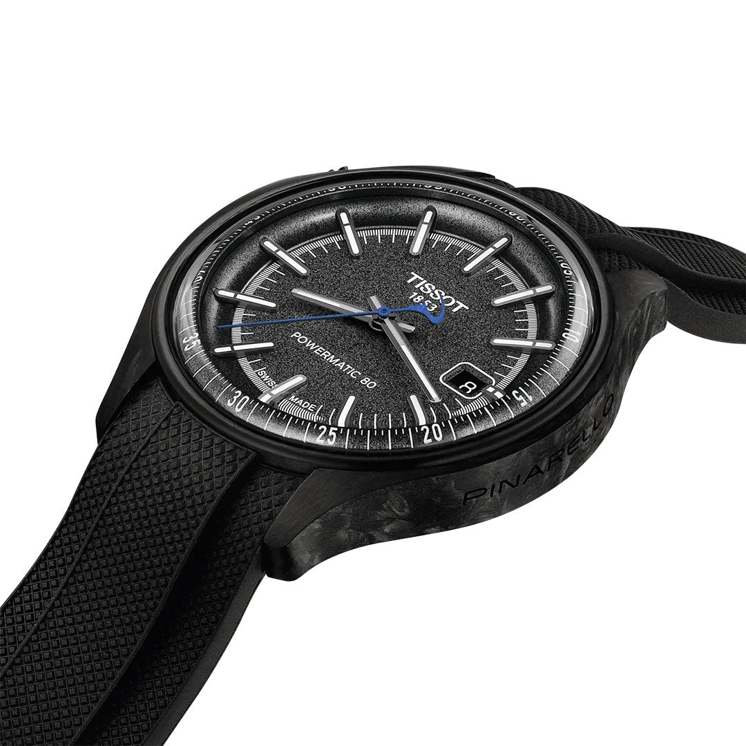 The Tissot Pinarello Mechanical Automatic COSC 43mm Watch features a black textured rubber strap, dark dial with silver markers, blue second hand accents, date at 3 o'clock, and "Pinarello" engraving—created with the performance bicycle brand.