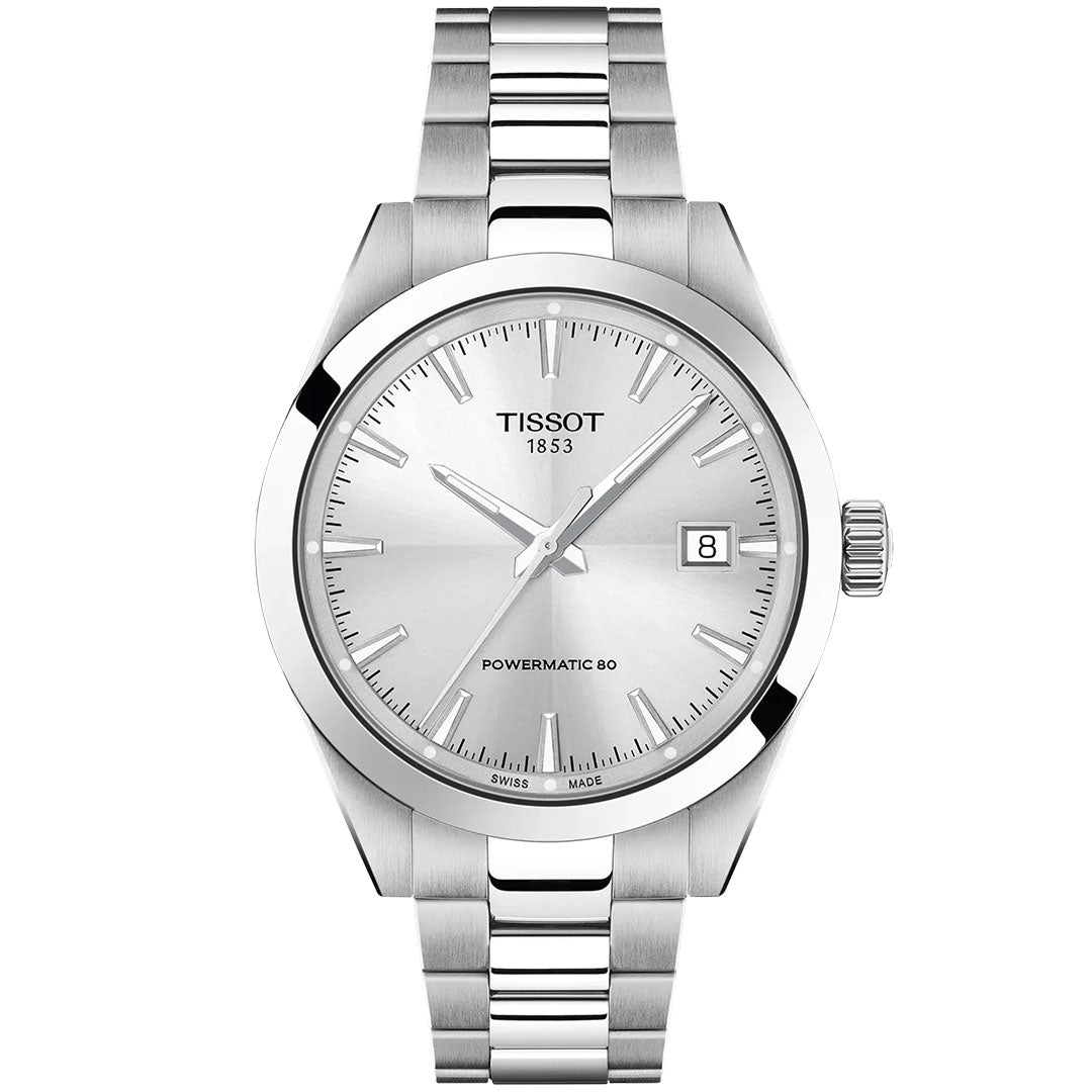 The Tissot Gentleman Powermatic 80 Automatic 38mm Watch features a silver metal band, a minimalist silver dial, date at 3 o’clock, and “Tissot 1853” and “Powermatic 80” on the face.