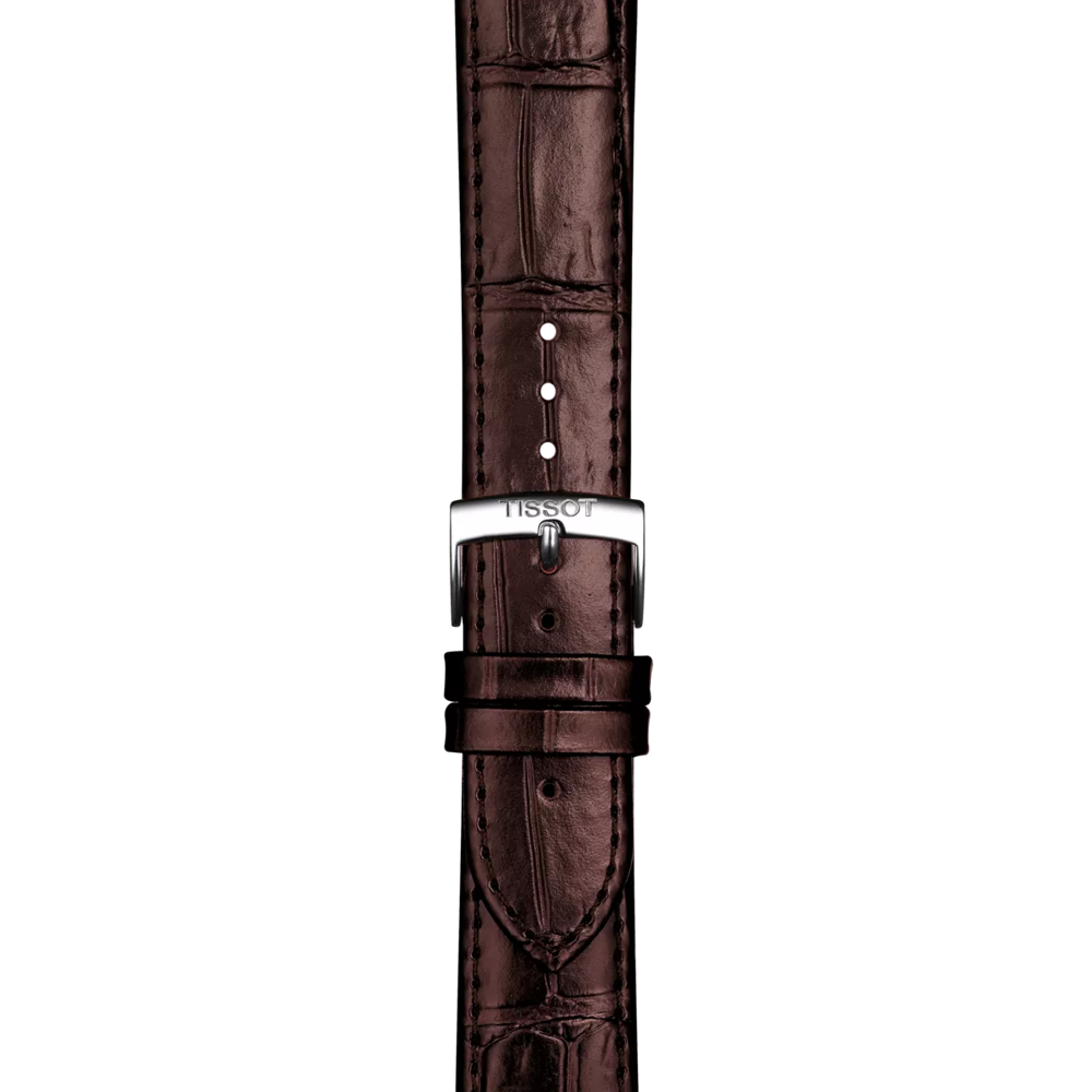 Close-up of the Tissot Official Brown Leather Strap Lugs 20 mm, featuring a brown leather band and a silver buckle engraved with the Tissot logo, shown against a white background.