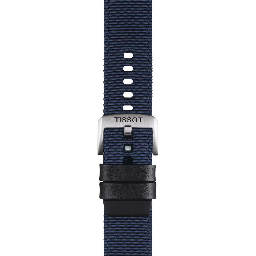 A close-up of the Tissot Official Blue Fabric Strap Lugs 22 mm shows its textured blue finish, metal clasp engraved with "TISSOT," multiple adjustment holes, and two black loops.