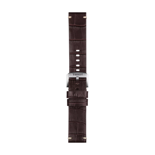 The Tissot Official Brown Leather Strap Lugs 22 mm features a dark brown crocodile-patterned leather design, a silver buckle engraved with "TISSOT," and multiple holes for adjustable sizing, set against a white background.