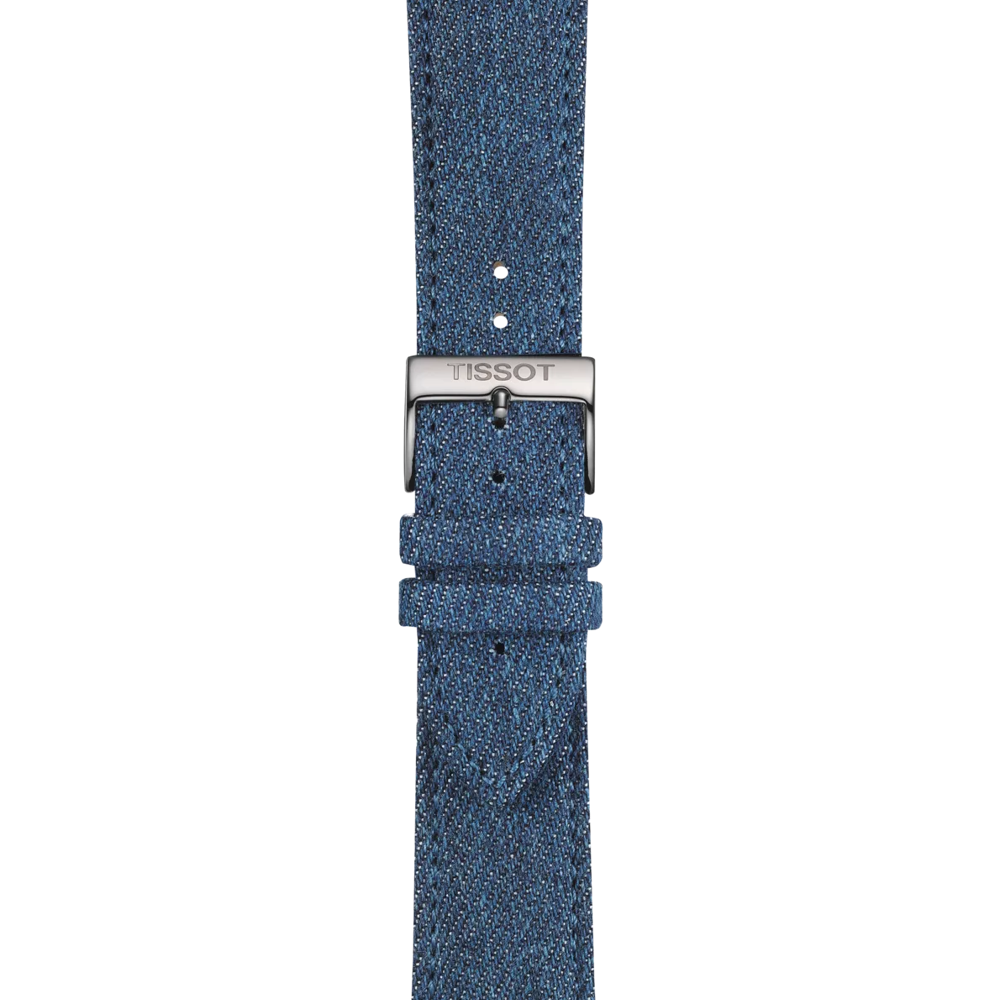 Close-up of the Tissot Official Blue Textile Strap (22 mm lugs), featuring a blue textured fabric and a silver buckle engraved with the Tissot logo, set against a plain light background.