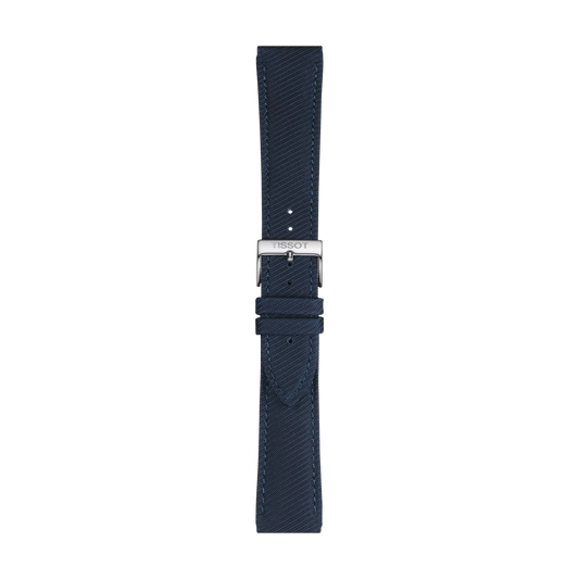 The Tissot Official Blue Textile Strap features a dark blue textured design with detailed stitching, a silver buckle engraved with the Tissot brand name, and multiple adjustment holes. The strap is suitable for 22 mm lugs and is pictured against a white background.