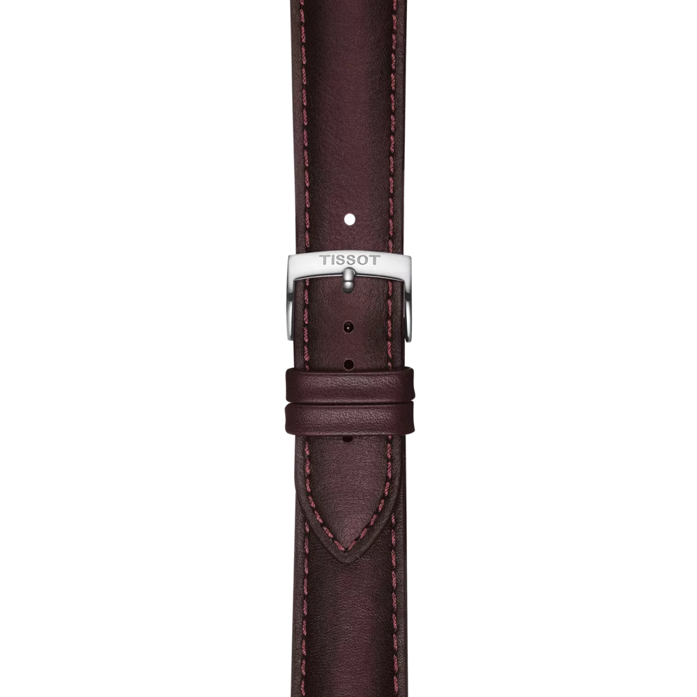 A close-up of the Tissot Official Brown Leather Strap with 20 mm lugs, showcasing brown leather with matching stitching and a silver buckle engraved with the Tissot brand name, set against a plain white background.