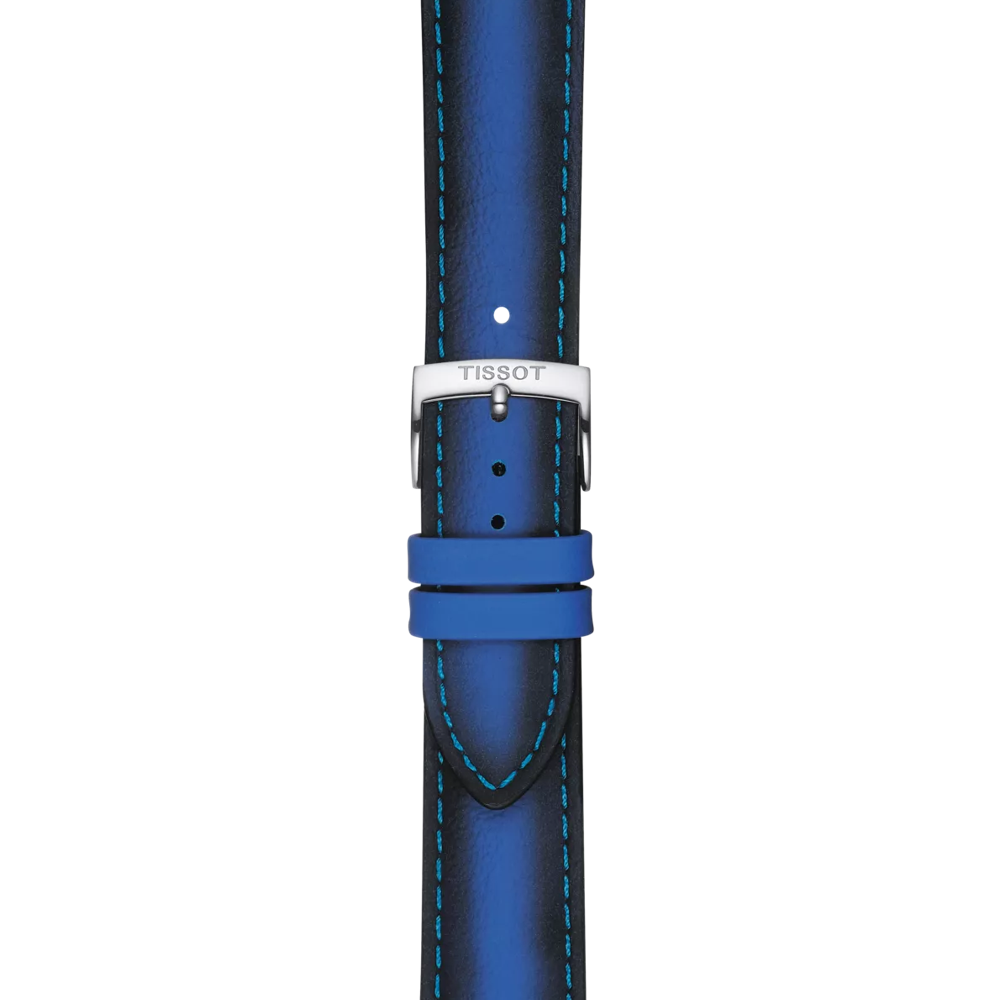 A detailed view of the Tissot Official Blue Leather Strap (Lugs 20 mm) features blue leather with light blue stitching, a silver TISSOT-engraved buckle, and two matching blue loops.