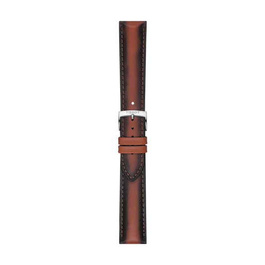 The Tissot Official Brown Leather Strap features 20 mm lugs, darker edges, light stitching, a silver buckle engraved with "Tissot," and two loops for securing the strap. It is shown vertically against a white background.