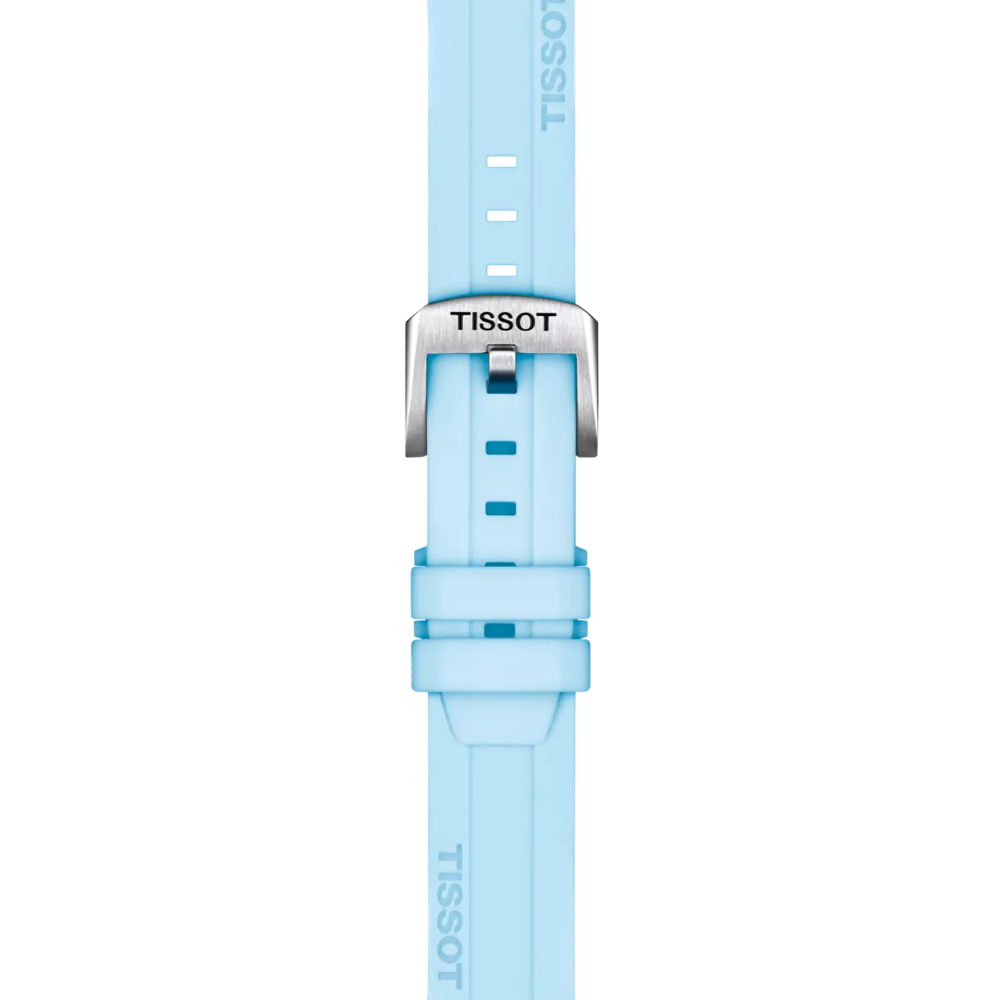 A Tissot Official Blue Silicone Strap with 22 mm lugs is shown vertically on a white background, featuring a light blue color and a silver buckle. The word "TISSOT" appears on both the strap and the buckle.