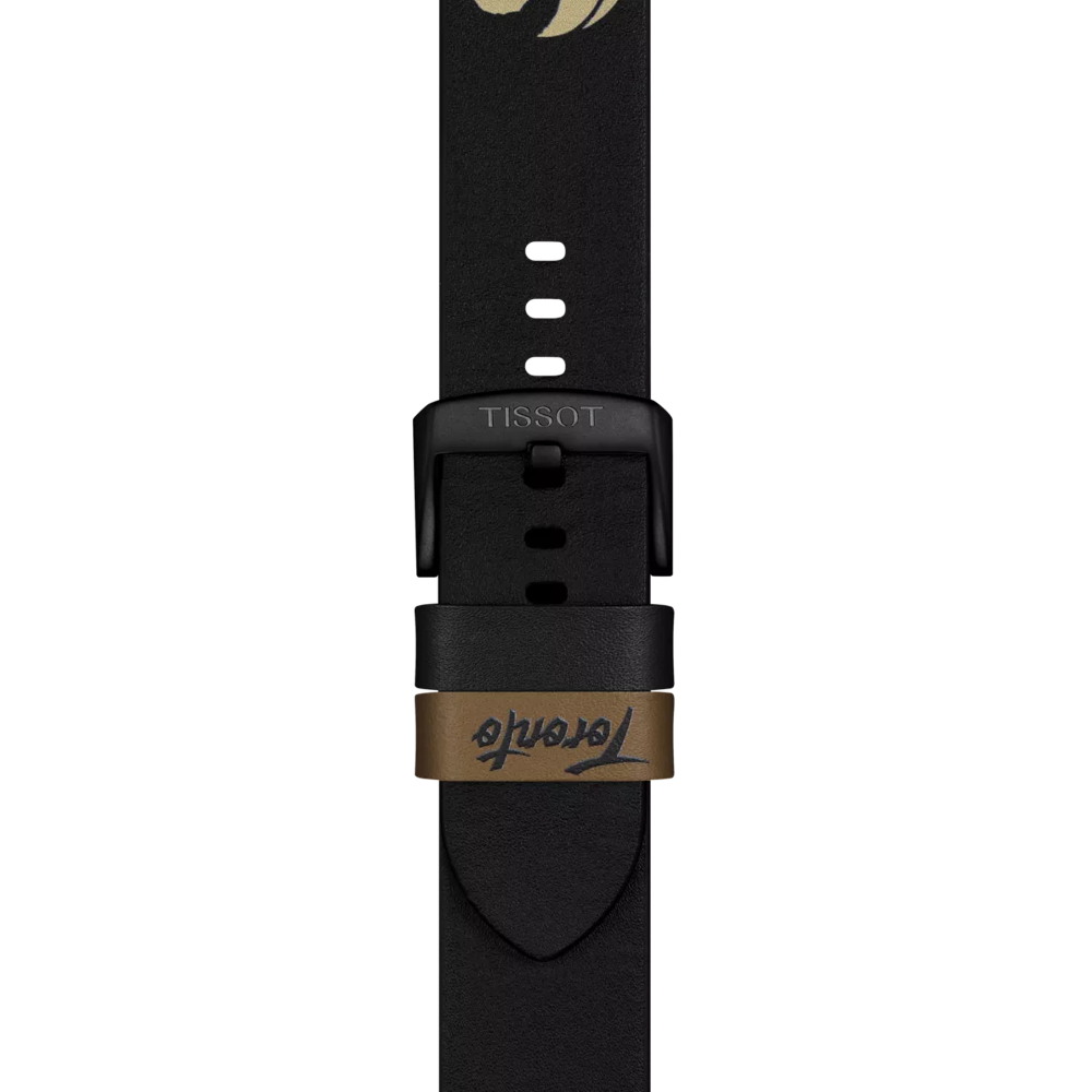 Close-up of the Tissot Official Black Leather Strap (22 mm lugs) featuring a black buckle and a brown loop with "Tende" written in cursive. The strap, made by Tissot, also displays small adjustment holes.
