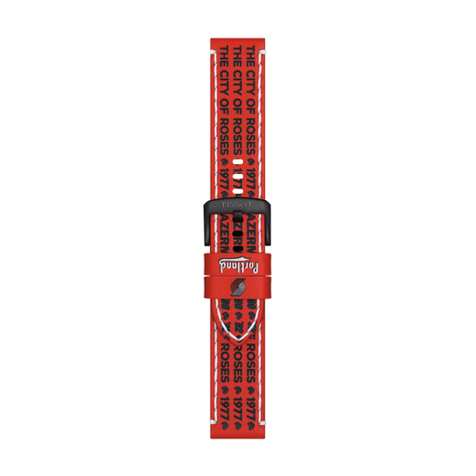 Tissot Official Red Leather Strap (22 mm lugs) featuring black text that repeatedly states "THE CITY OF ROSES 1974" and "PORTLAND" on a white background. The strap has a black buckle and the "Tissot" brand name appears on the strap loop.