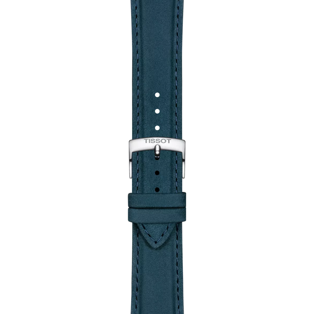 The Tissot Official Blue Leather Strap (Lugs 21 mm) by Tissot features a silver buckle engraved with the TISSOT logo. This elegant strap includes multiple adjustment holes and fine blue stitching along the edges, displayed against a plain white background.