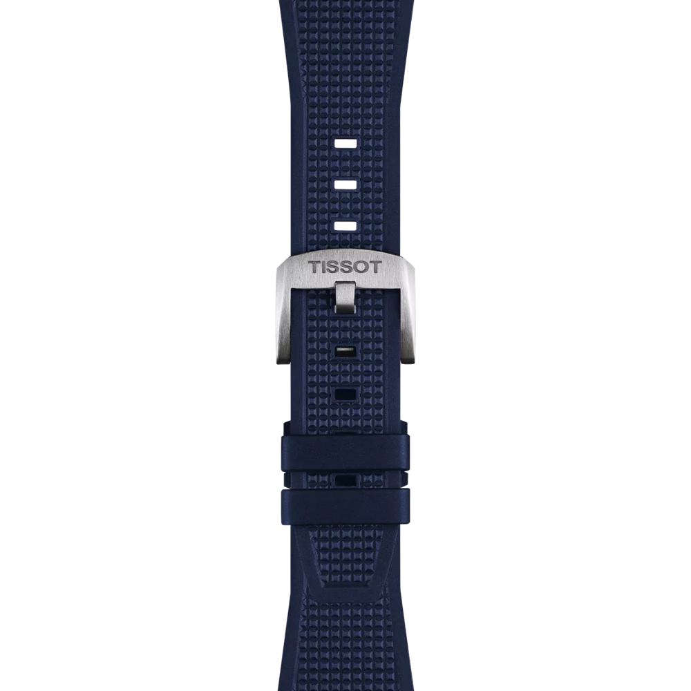A close-up of the Tissot Official Blue PRX 40mm Rubber Strap, featuring a navy blue textured design and a silver buckle engraved with "TISSOT," displayed against a plain white background.