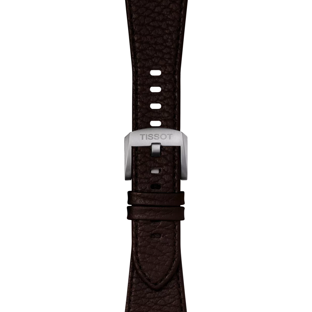 A close-up of the Tissot Official Brown PRX 40mm Leather Strap, featuring a dark brown textured leather band and a silver buckle engraved with "TISSOT," set against a plain white background.