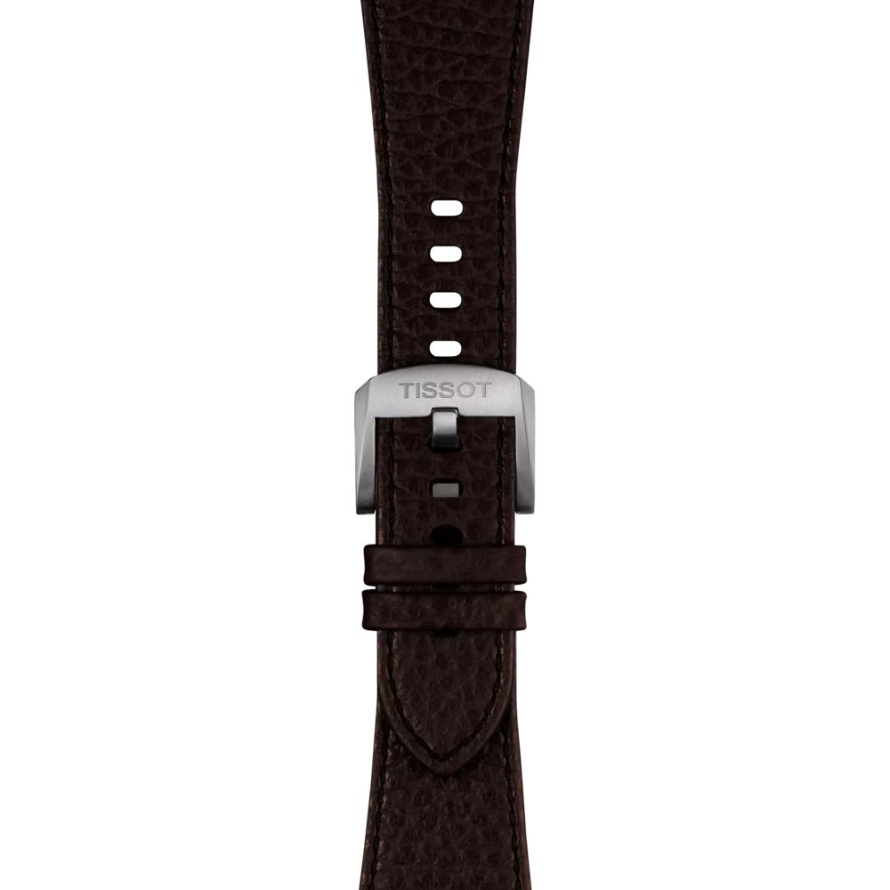Close-up of the Tissot Official Brown PRX 42mm leather strap featuring a textured brown leather design and a silver buckle engraved with "TISSOT," displayed against a plain white background.