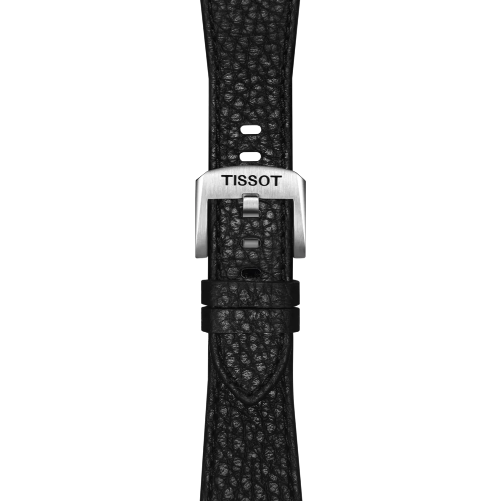A close-up of the Tissot Official Black PRX 35mm Leather Strap showcases its black textured leather and silver buckle, engraved with "TISSOT." The strap—featuring two loops—is displayed against a plain, light background.