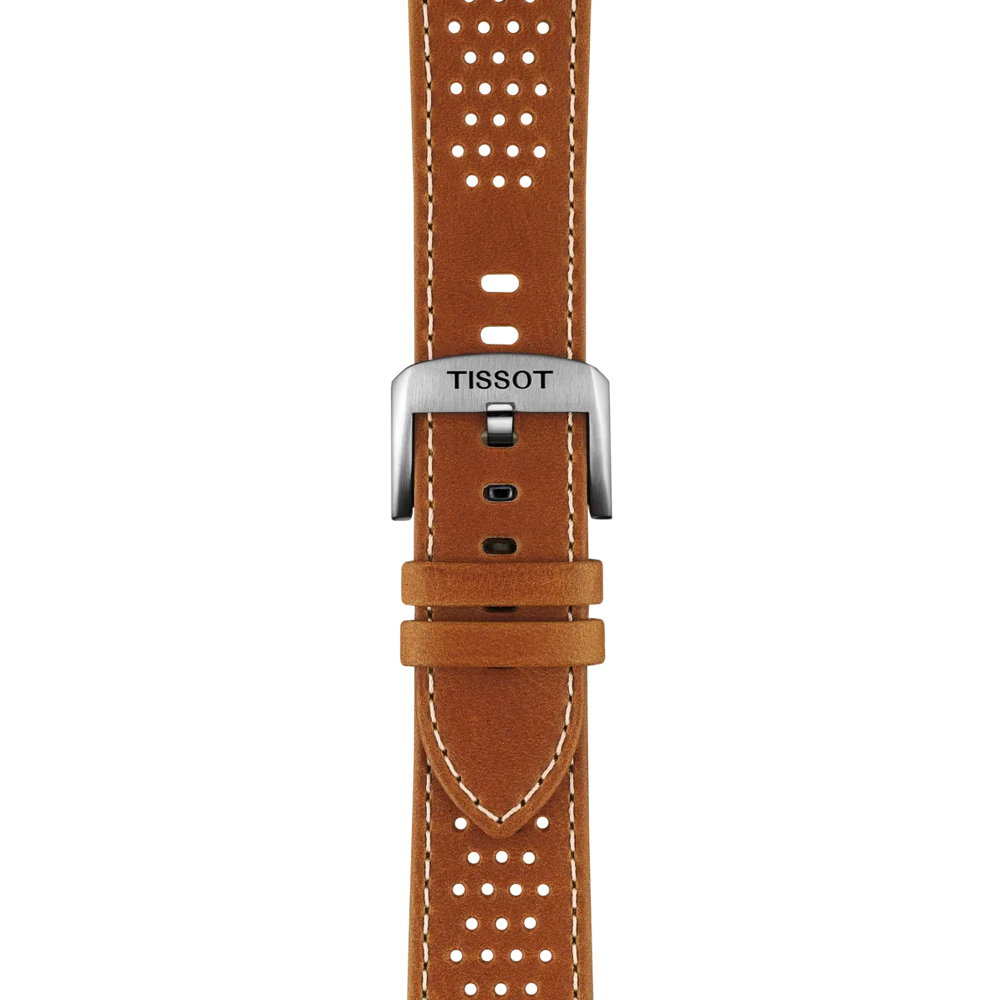 The Tissot Official Light Brown Leather Strap Lugs 22mm features a brown leather watch strap with white stitching and perforated holes, complemented by a silver buckle engraved with the "TISSOT" brand name in black letters. The strap is displayed vertically against a white background.