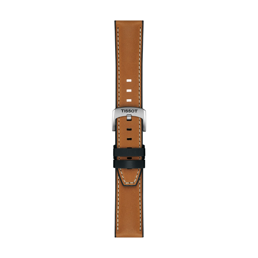 The Tissot Official Light Brown Leather Strap features white stitching, a silver buckle engraved with the Tissot brand name, and multiple adjustment holes. The strap is shown vertically against a plain white background.