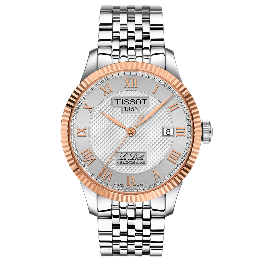 The Tissot Le Locle COSC Automatic 39.3mm Watch features a silver link band, textured white dial with Roman numerals, an 18K gold bezel, Swiss automatic movement, and a date window at 3 o’clock.