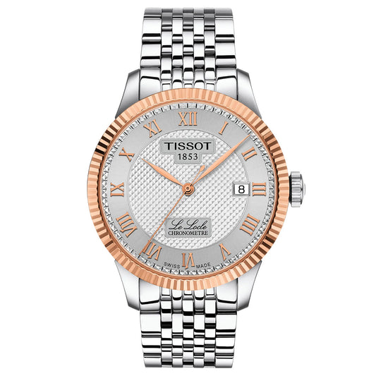 The Tissot Le Locle COSC Automatic 39.3mm Watch features a silver link band, textured white dial with Roman numerals, an 18K gold bezel, Swiss automatic movement, and a date window at 3 o’clock.