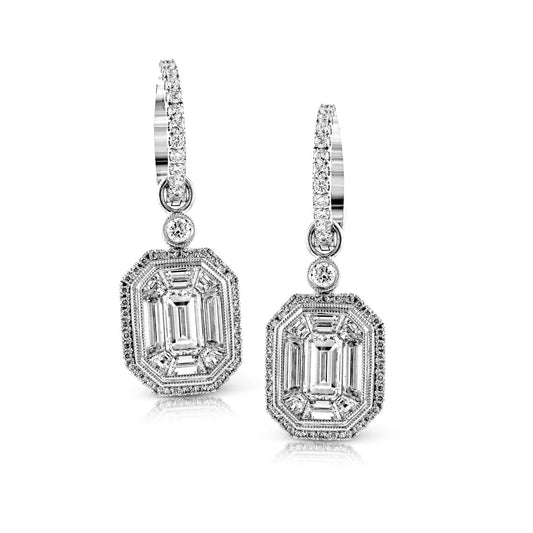 The Simon G. 18K White Gold Emerald with Diamond Earrings by Simon G showcase large emerald-cut diamonds encircled by smaller round diamonds in an octagonal design, creating a delicate and shimmering look that hangs from diamond-studded hoops.