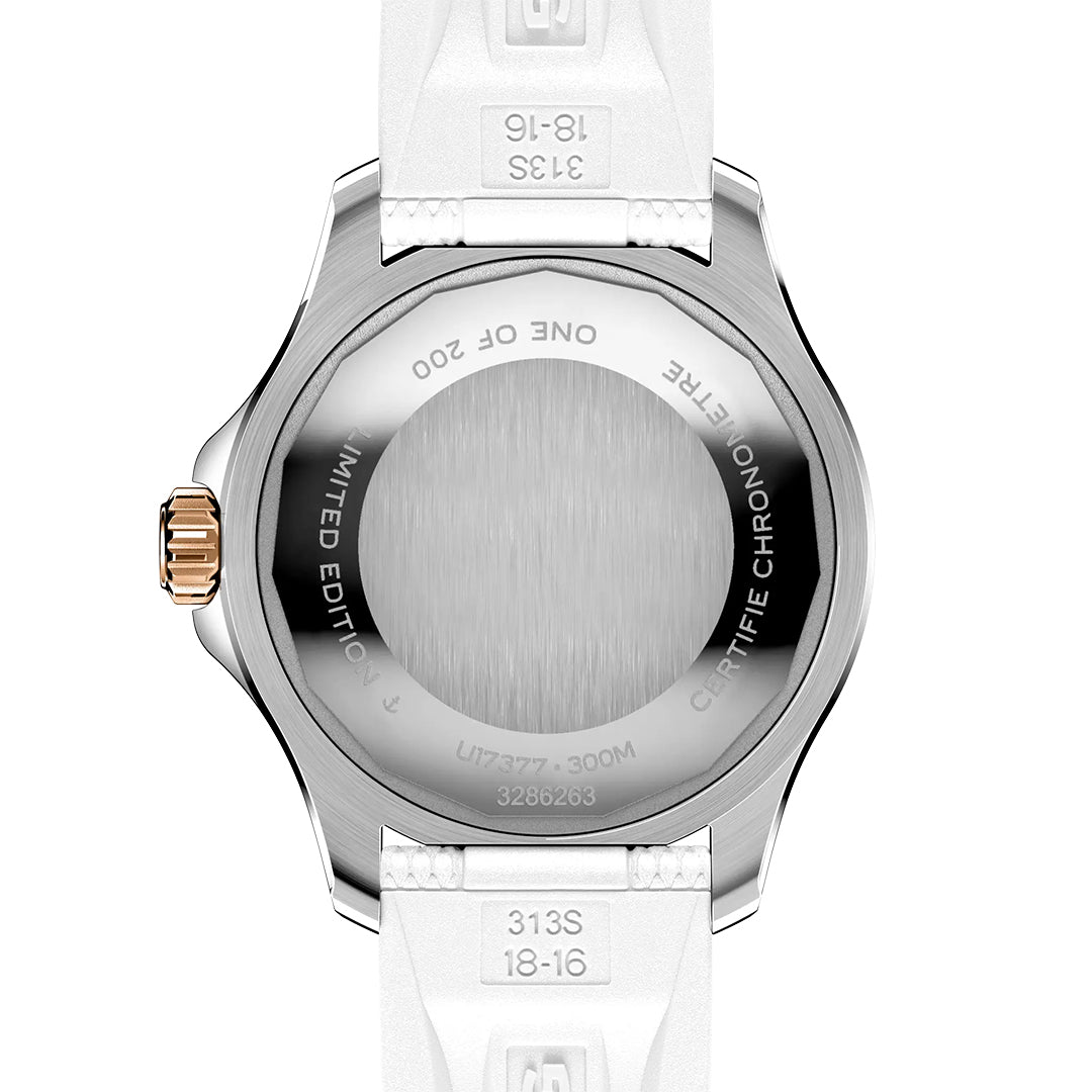 The back of the Breitling Superocean Automatic 36 features a brushed metal case back with engraved text such as "LIMITED EDITION," "ONE OF 200," and "300M." It has a white strap, silver case, and gold crown.