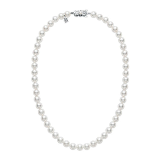 A Mikimoto Akoya cultured pearl strand necklace is elegantly displayed in a circular shape on a pristine white background. The piece features evenly spaced pearls, beautifully accentuated with an 18K white gold clasp at the top.