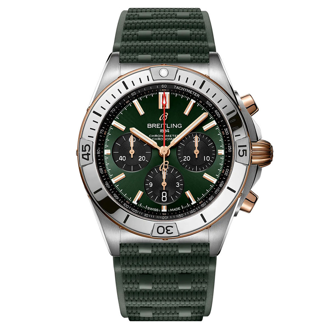 The BREITLING Chronomat B01 42 by Breitling is a luxury pilot's watch featuring a green face and strap, accented with gold and silver details. It includes a chronograph with three subdials, a tachymeter scale, and a date window. The textured strap beautifully complements the bezel designed for diving.