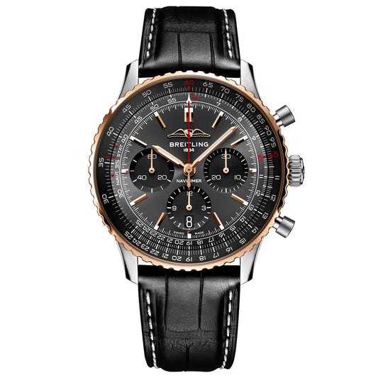 The Breitling Navitimer B01 Chronograph 43 Limited Edition is a luxury pilot’s watch featuring a black dial, three subdials, silver and rose gold bezel, and a black leather strap with white stitching.
