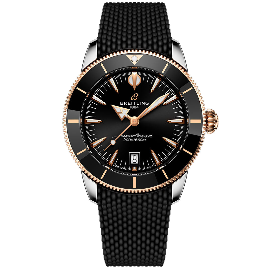 The BREITLING Superocean Heritage B31 Automatic 42 features a black dial with gold accents, black bezel, date display at 6 o’clock, textured black strap, and is water resistant to 200m/660ft.