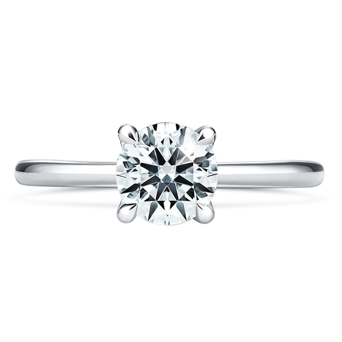 The Hearts On Fire Vela Platinum Semi Mount Solitaire Engagement Ring is a platinum ring designed by Hearts on Fire, featuring a single round diamond in a four-prong setting. Its sleek and polished band enhances the diamond's sparkle, making it ideal for those who admire timeless elegance.