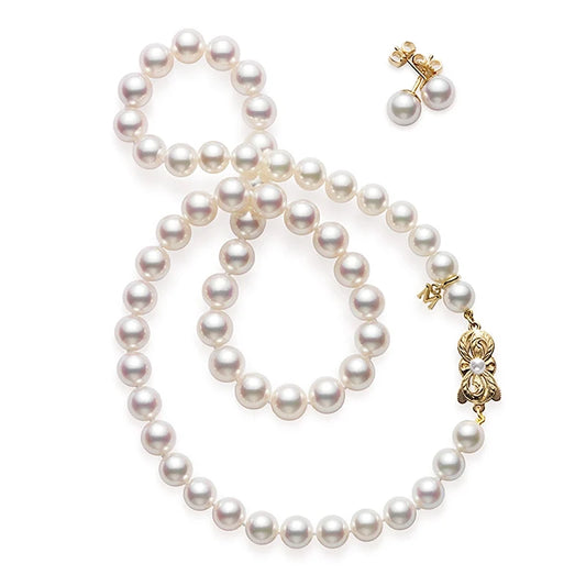 The Mikimoto 18K Yellow Gold Akoya Cultured Pearl Strand Necklace and Stud Earrings Two-Piece Set by Mikimoto, featuring luminous white Akoya pearls and an elegant floral clasp, is beautifully displayed on a white background.
