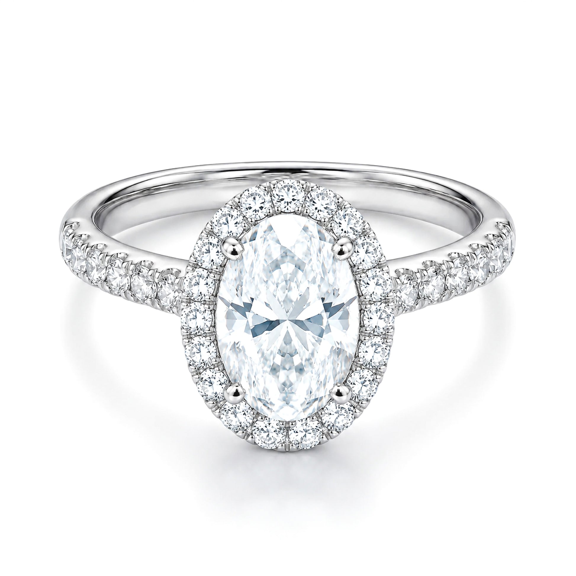 The Raffi&Co.® 14K White Gold Oval Halo Diamond Engagement Ring showcases a stunning 3.56 ct oval diamond, surrounded by a halo of smaller diamonds and more diamonds set along the band.