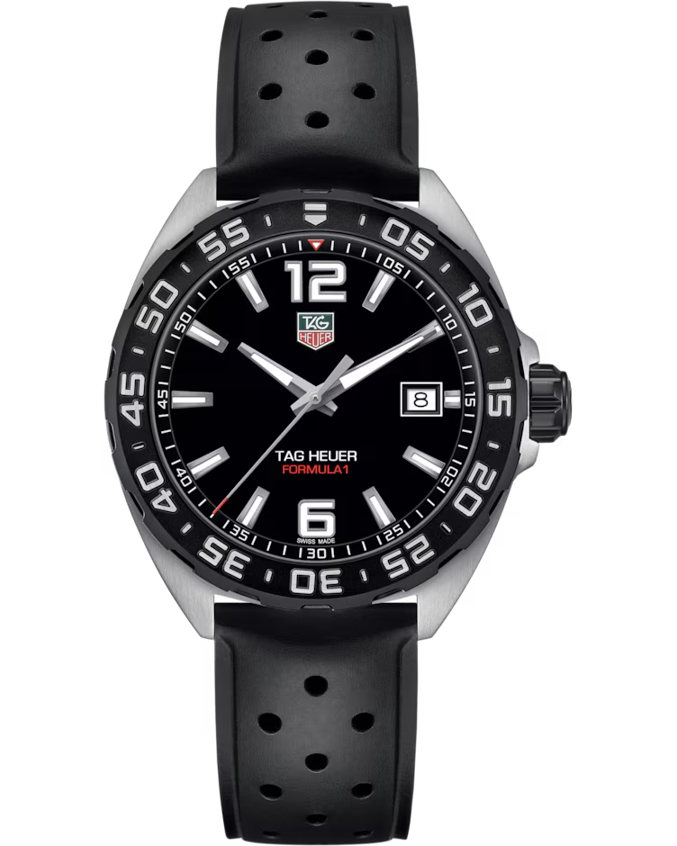 The TAG Heuer Formula 1 Date Quartz 41mm Watch by TAG Heuer features a black dial, black perforated strap, silver bezel, luminous hands, a date window at the 3 o’clock position, and bold white numerals at both 6 and 12 o’clock.