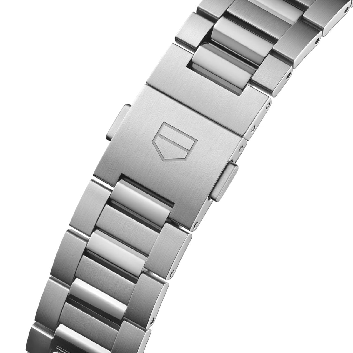 A close-up of a stainless steel TAG Heuer Carrera Date Automatic 39mm Watch bracelet with a brushed finish and a clasp engraved with the iconic minimalist shield logo, highlighting the refined details of this TAG Heuer timepiece.