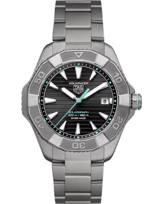 A TAG Heuer Aquaracer Professional 200 Solargraph Solar Quartz 40mm watch featuring a black dial with silver markers, turquoise accents, a date display at 3 o’clock, and a metal bracelet.