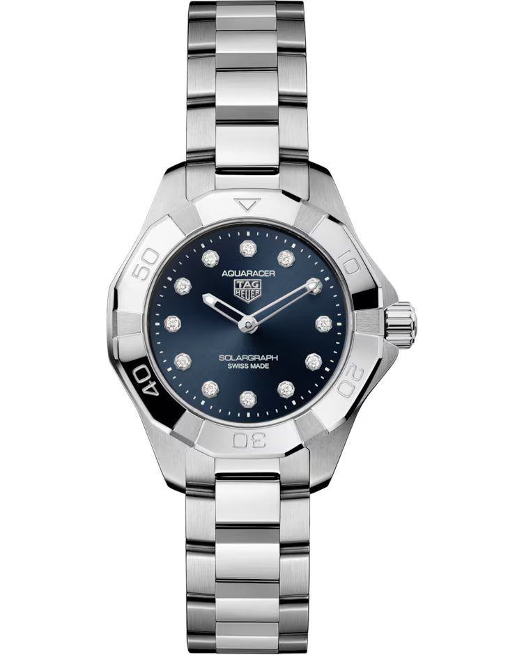 A TAG Heuer Aquaracer Professional 100 Solargraph Solar Quartz 28mm women’s watch featuring a silver-tone metal link band, blue dial with diamond hour markers, and a silver bezel engraved with numbers.