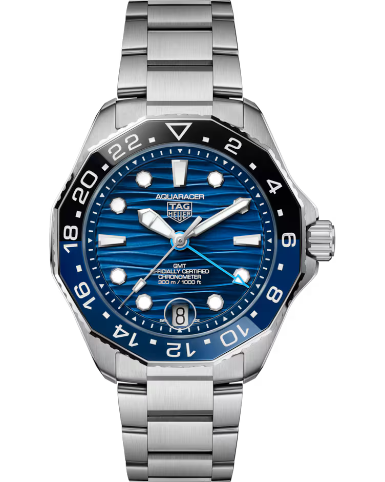 A TAG Heuer Aquaracer Professional 300 GMT Automatic 42mm watch featuring a stainless steel case, a blue dial, black and blue bezel, silver markers, and a date display at the 6 o’clock position. The time displayed on the watch is 10:09:32.