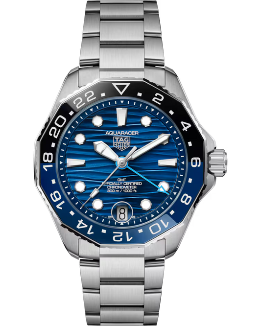 A TAG Heuer Aquaracer Professional 300 GMT Automatic 42mm watch featuring a stainless steel case, a blue dial, black and blue bezel, silver markers, and a date display at the 6 o’clock position. The time displayed on the watch is 10:09:32.