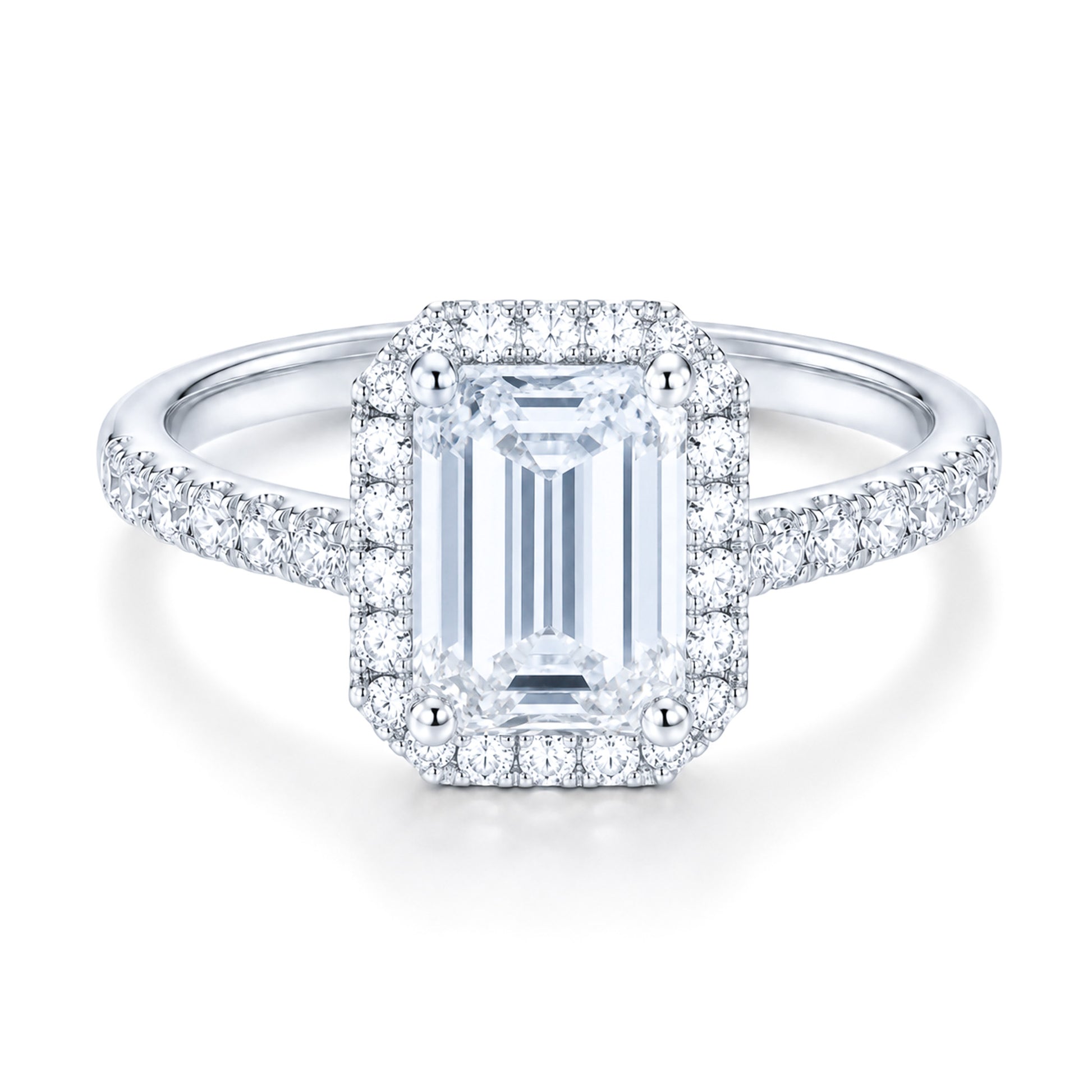 The Raffi&Co.® 14K White Gold Emerald Halo Diamond Engagement Ring features a large emerald-cut center diamond, a halo of round diamonds, and additional diamonds on the band.